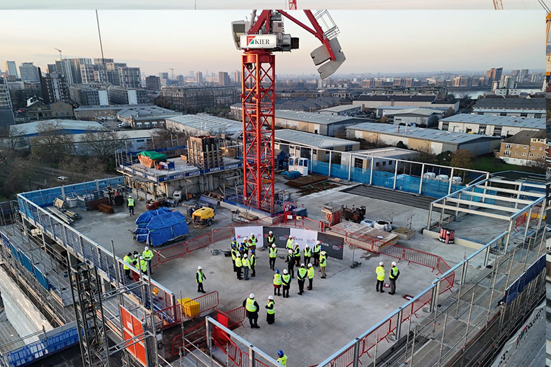 Guests in hi vis jackets on top of the new Greenwich Campus 