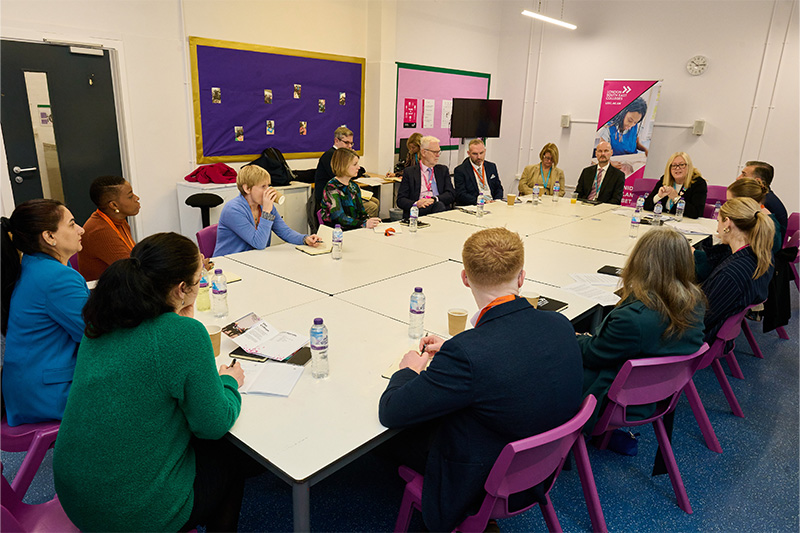 a view of the attendees seated around a table