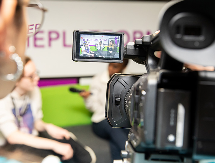 Students filming in the media suite