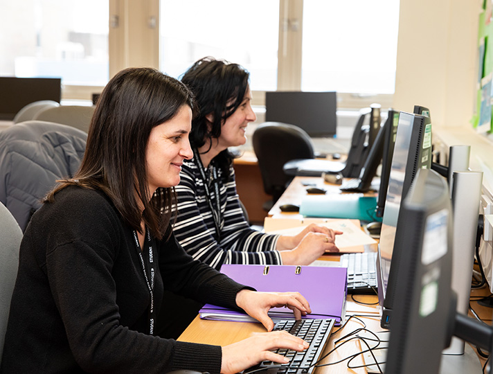 Students in the classroom using laptops