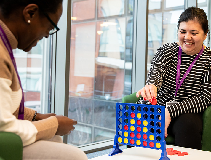 Students playing a game of connect 4